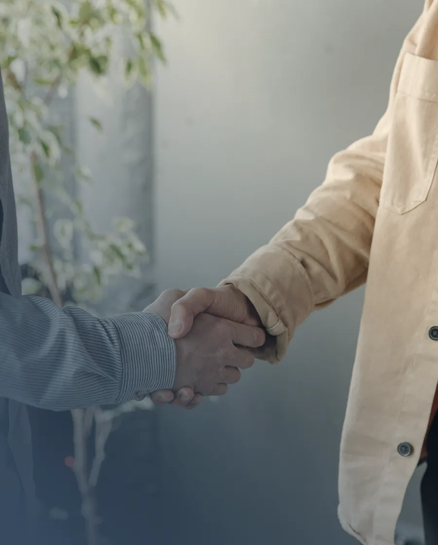 A lawyer shaking hands with a client