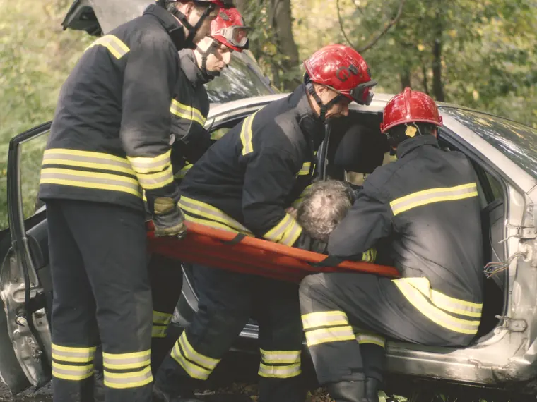Rescue crew freeing a driver from a wrecked car